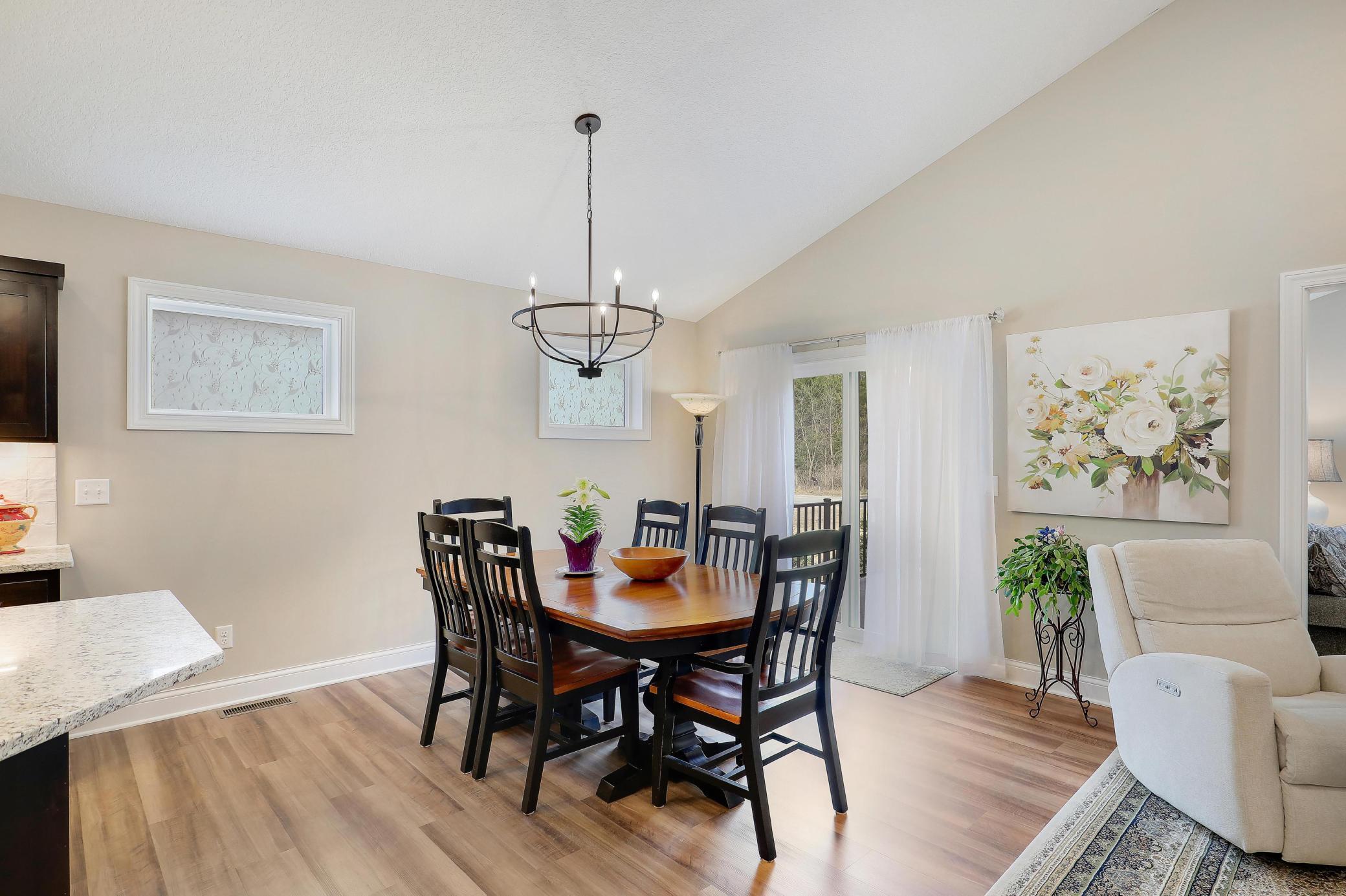 Dining area has a sliding door that opens to the deck