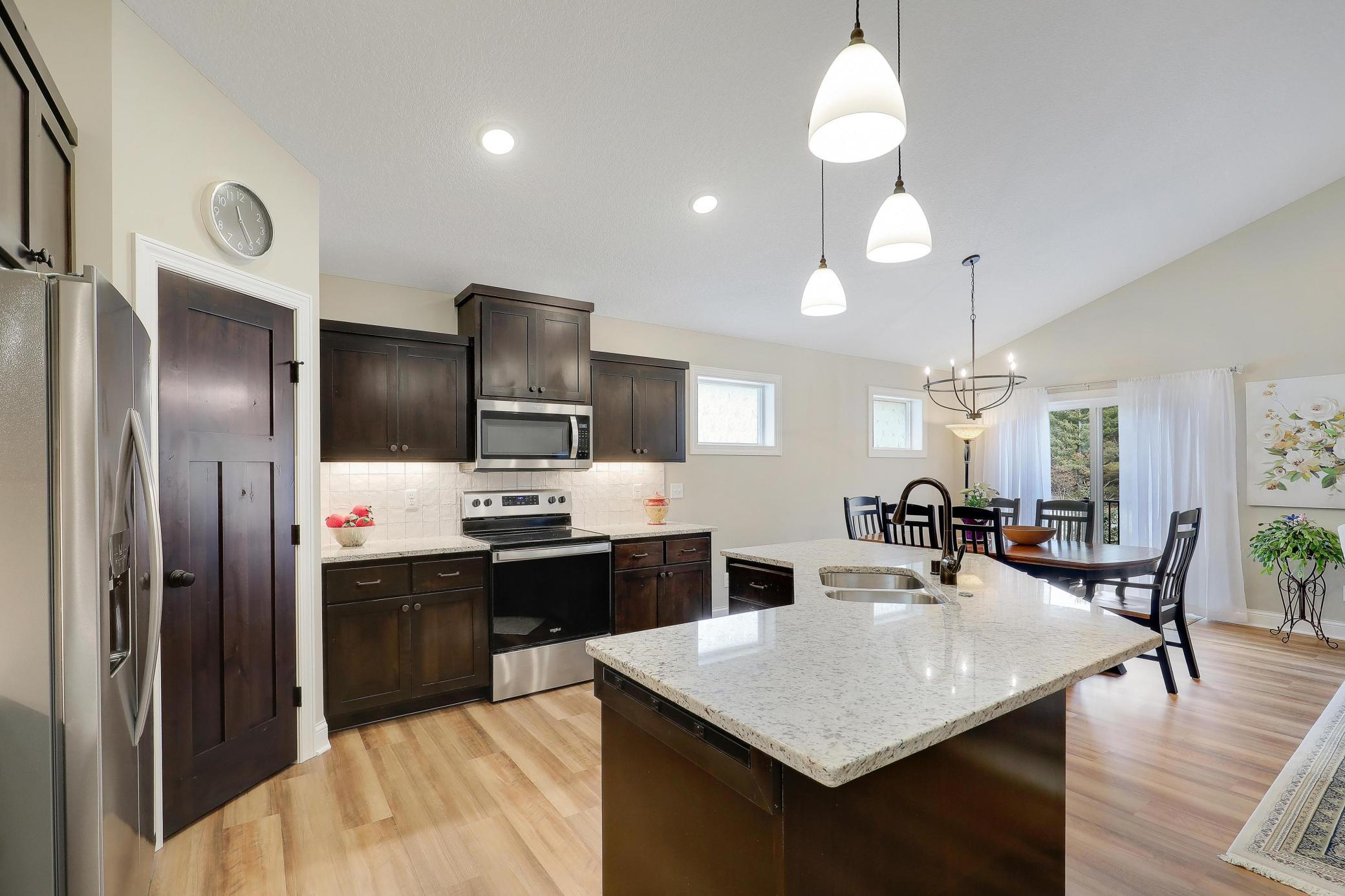 Large center island offers a wonderful workspace for meal prep