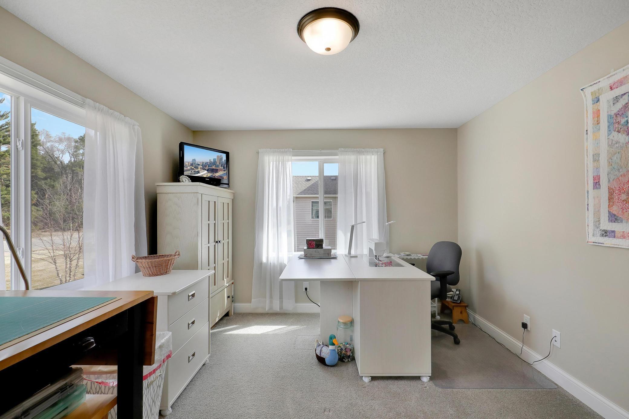 This flex room is currently used a sewing room and would also be great as an office, craft room, or third bedroom (needs a closet)