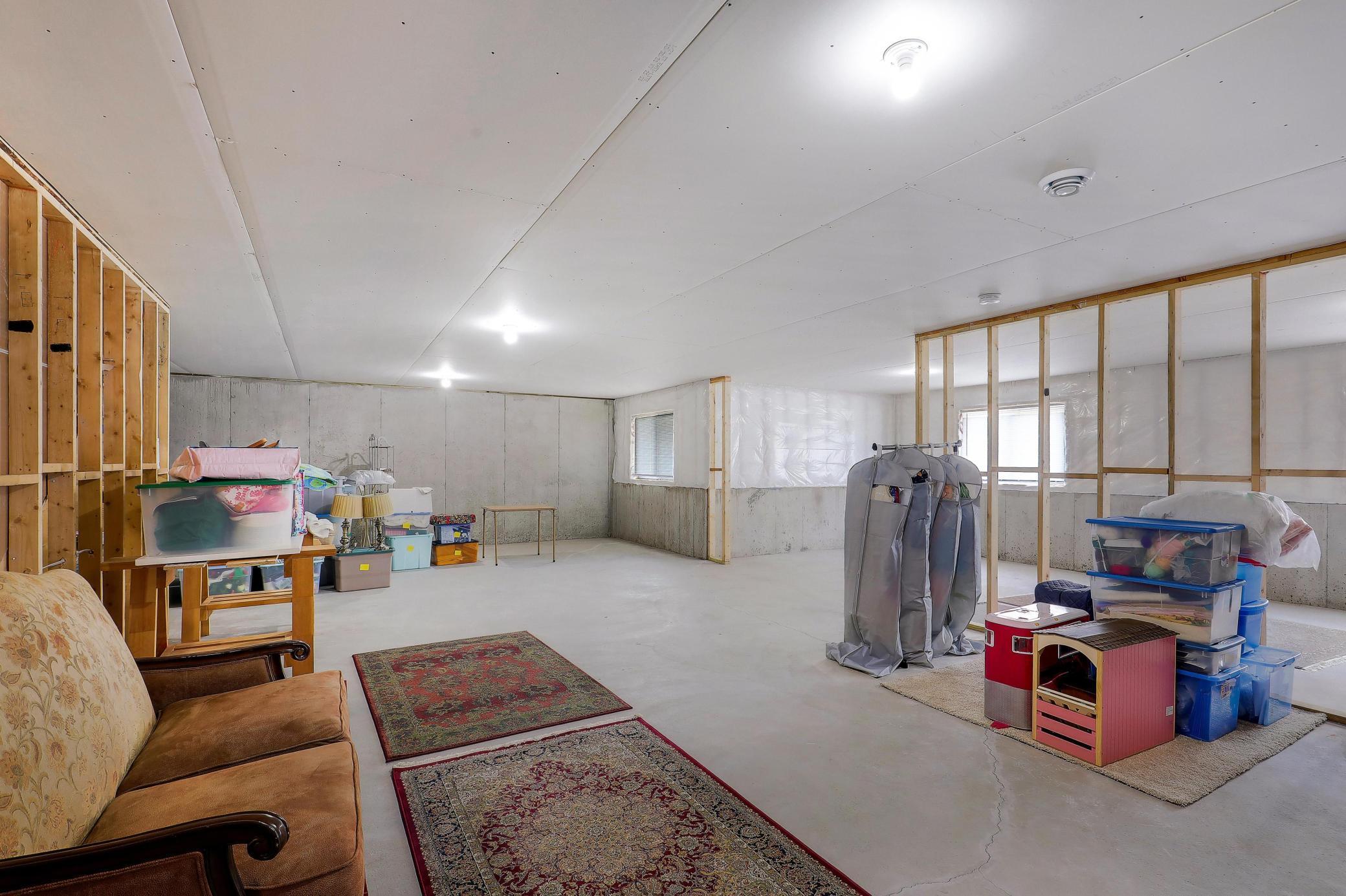 Lookout basement with lots of natural light is ready for your finishing, or provides PLENTY of storage space