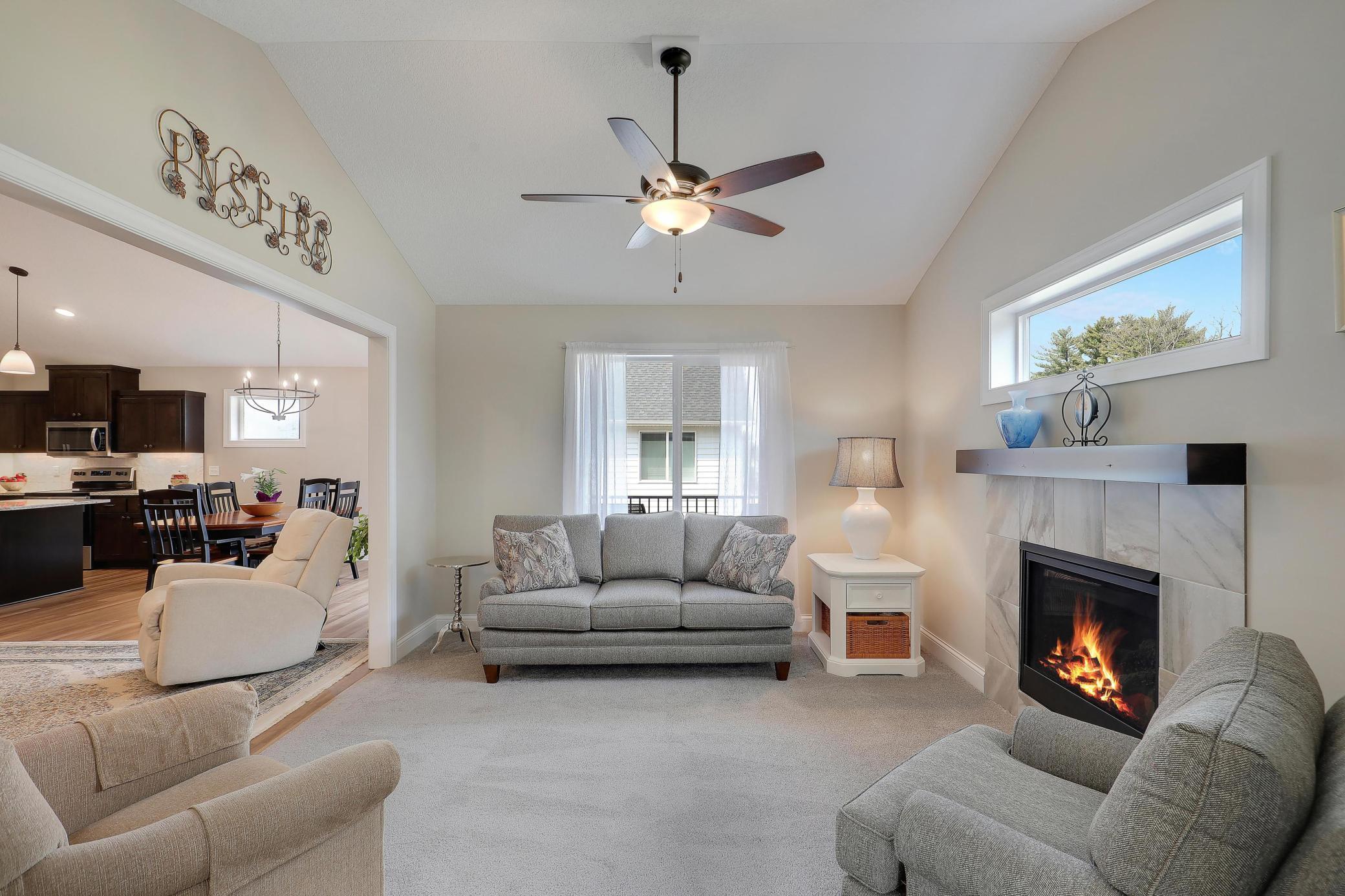 Sun room has lots of natural light and vaulted ceiling and is