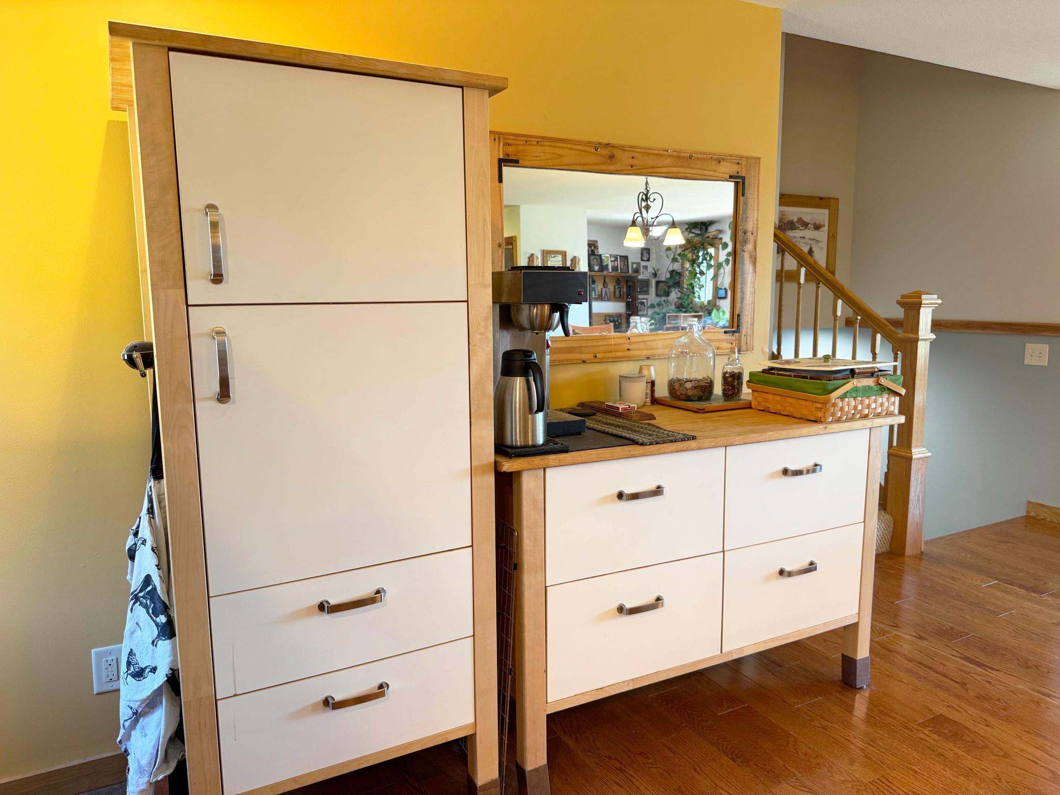 More kitchen cabinetry, featuring the coffee bar.