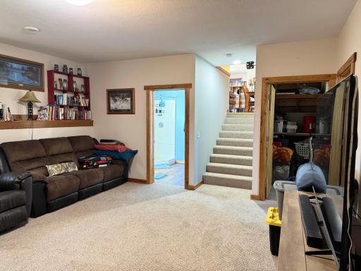 Another angle of the basement family room with the bathroom on the left and the laundry room on the right.