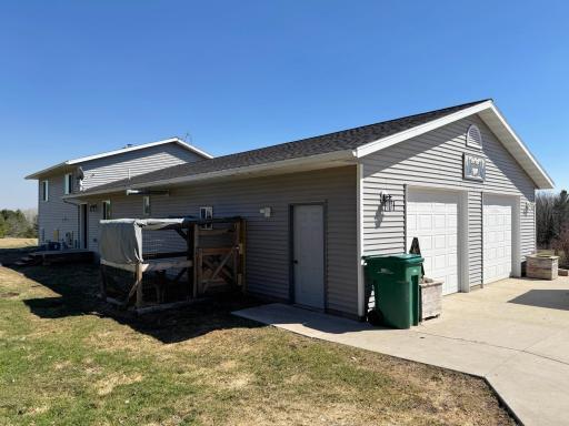 One more shot of the home's exterior, featuring the kennel and attached two-car garage.