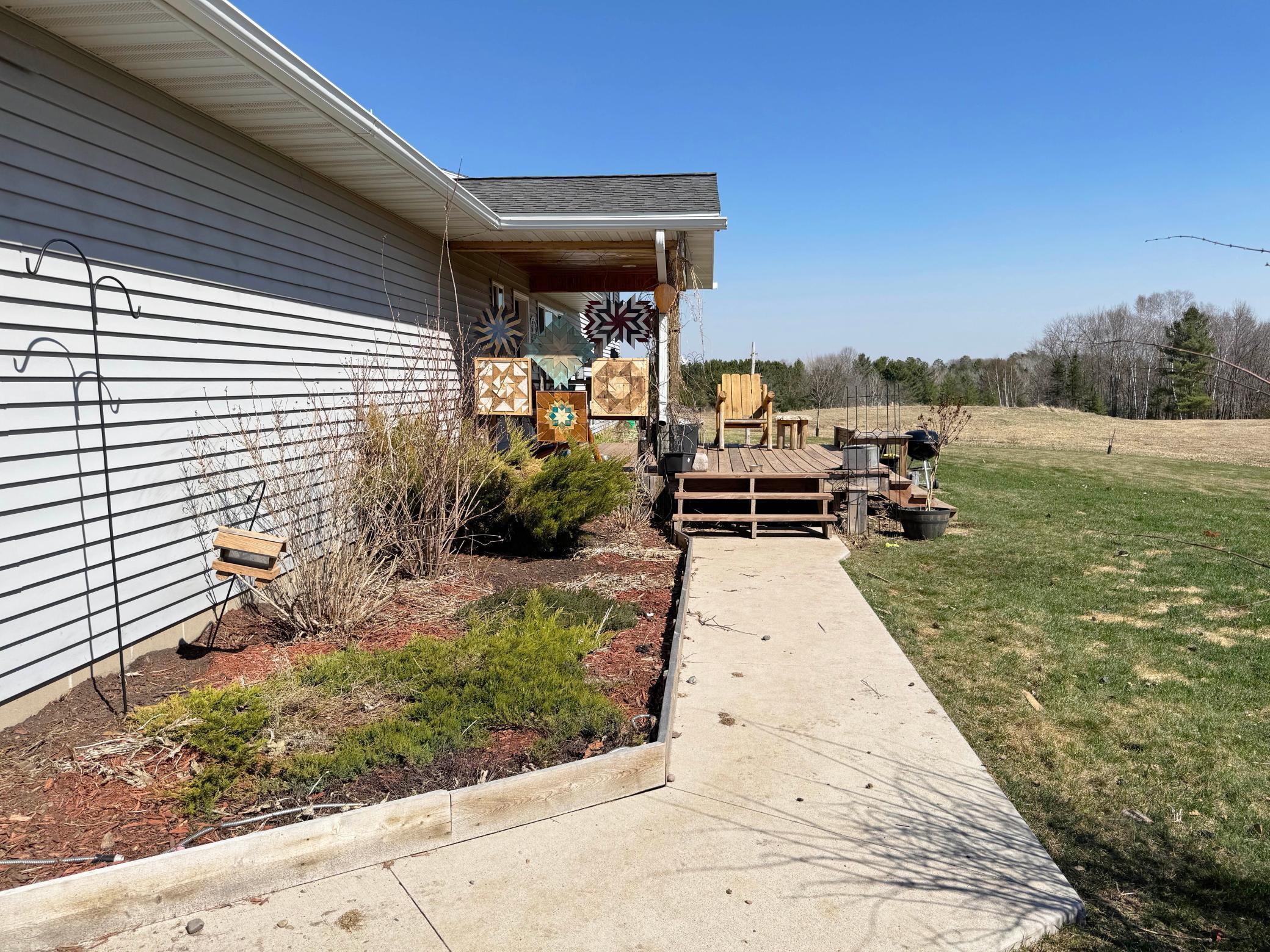 A look at the sidewalk leading to the porch and front entry.