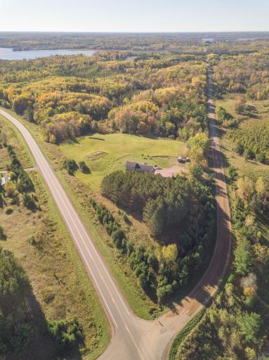 An aerial view of the property situated at the junction of the county and township roads. At this location, there are dozens of area lakes to enjoy at your fingertips, but then you can come home to enjoy your private nature haven!