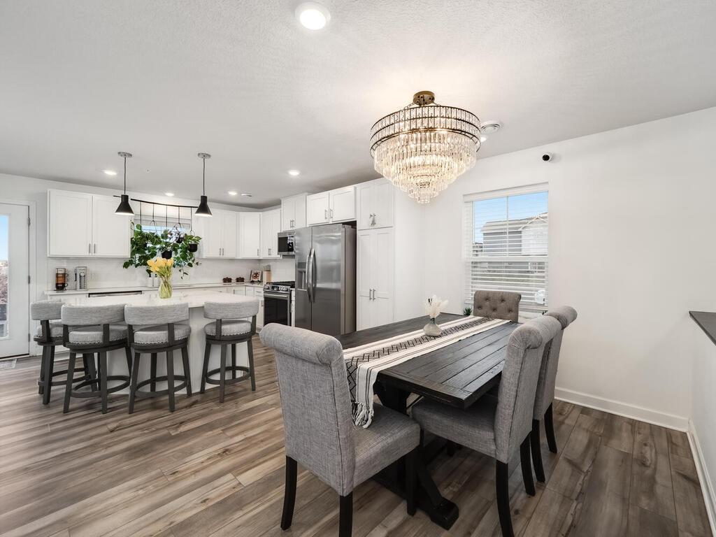 Beautiful Light Fixture, Formal Dining Area, Picture Window, LMV Flooring