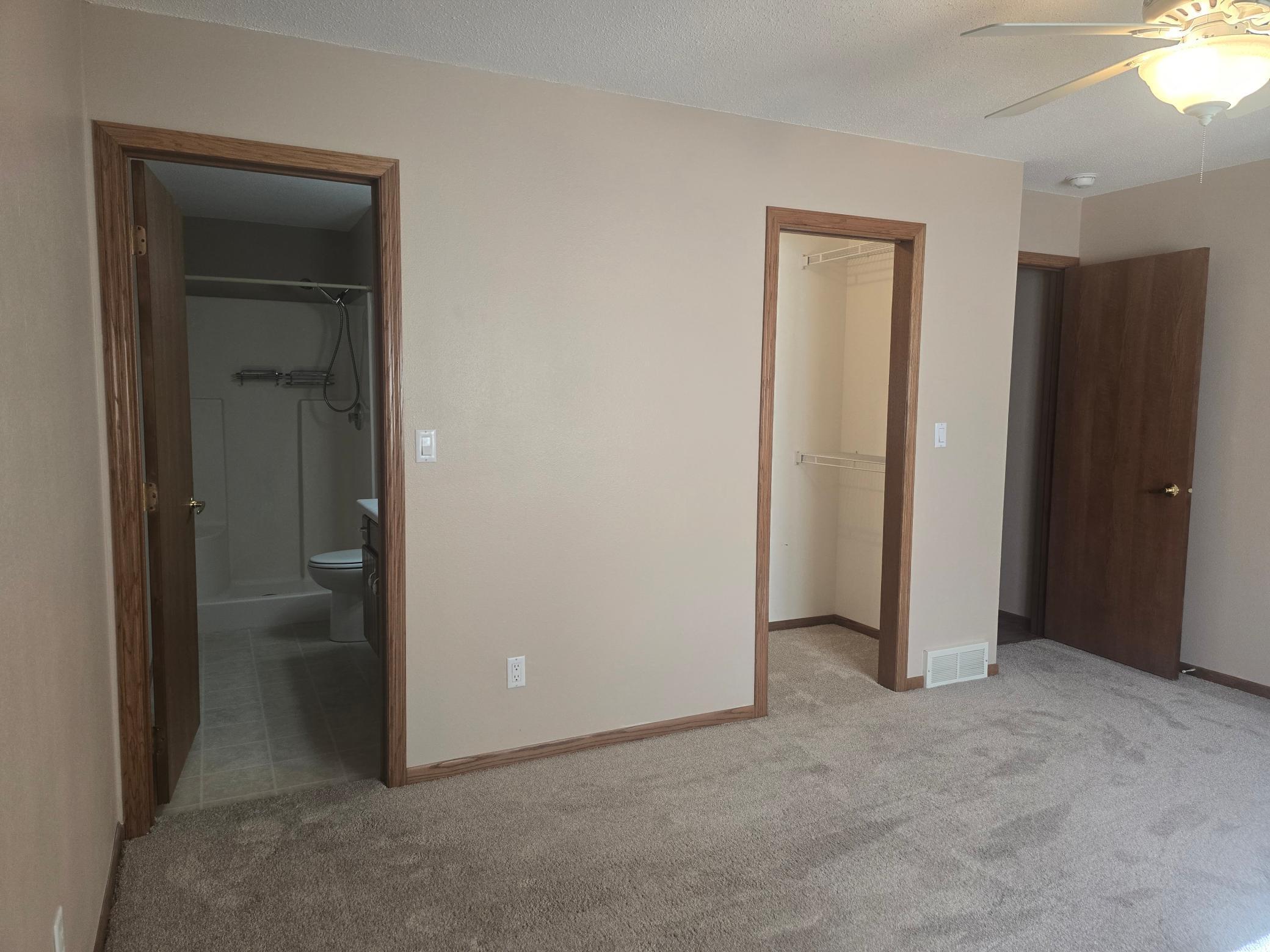 large primary bedroom with bath and walk in closet
