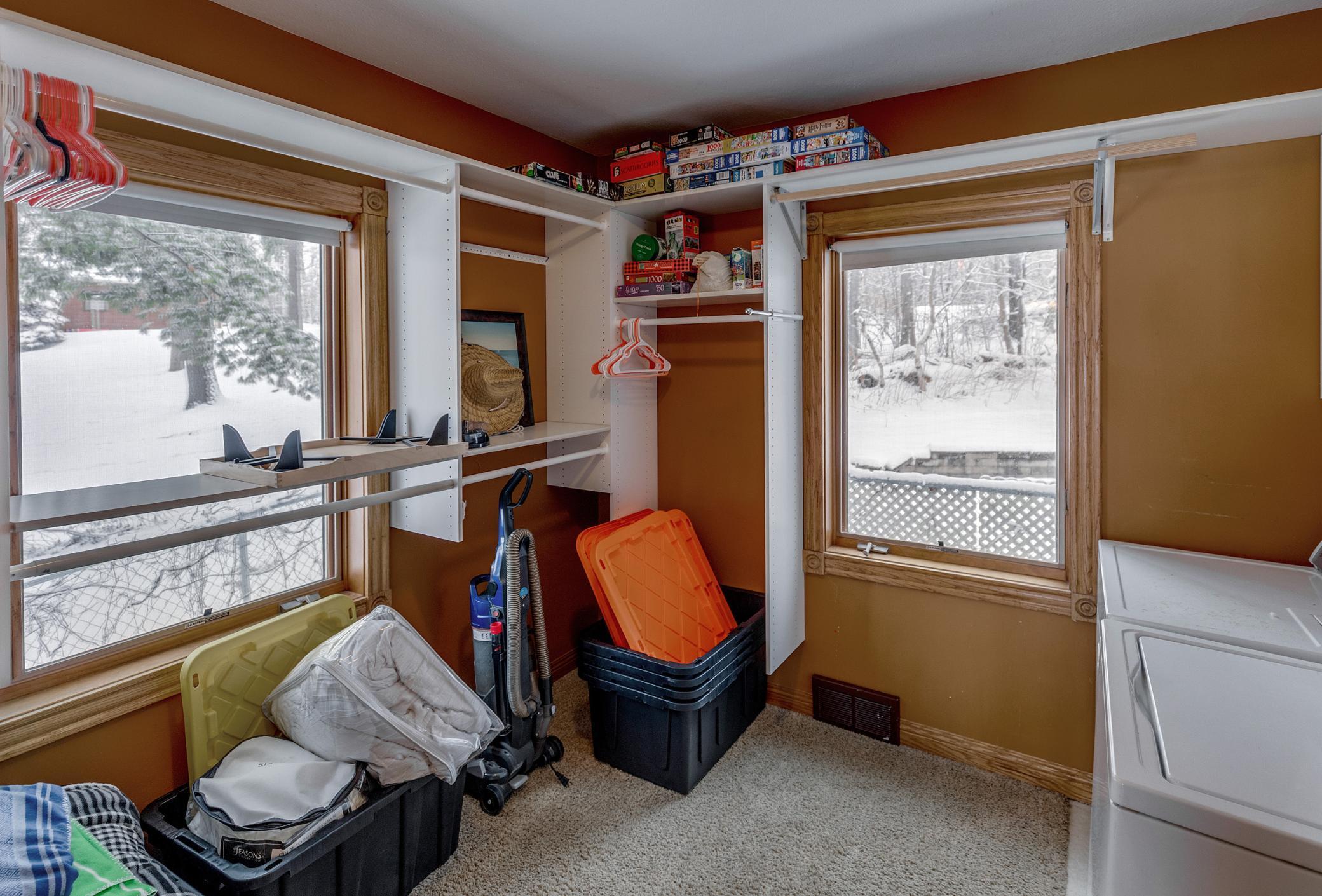 walk in closet in master with laundry