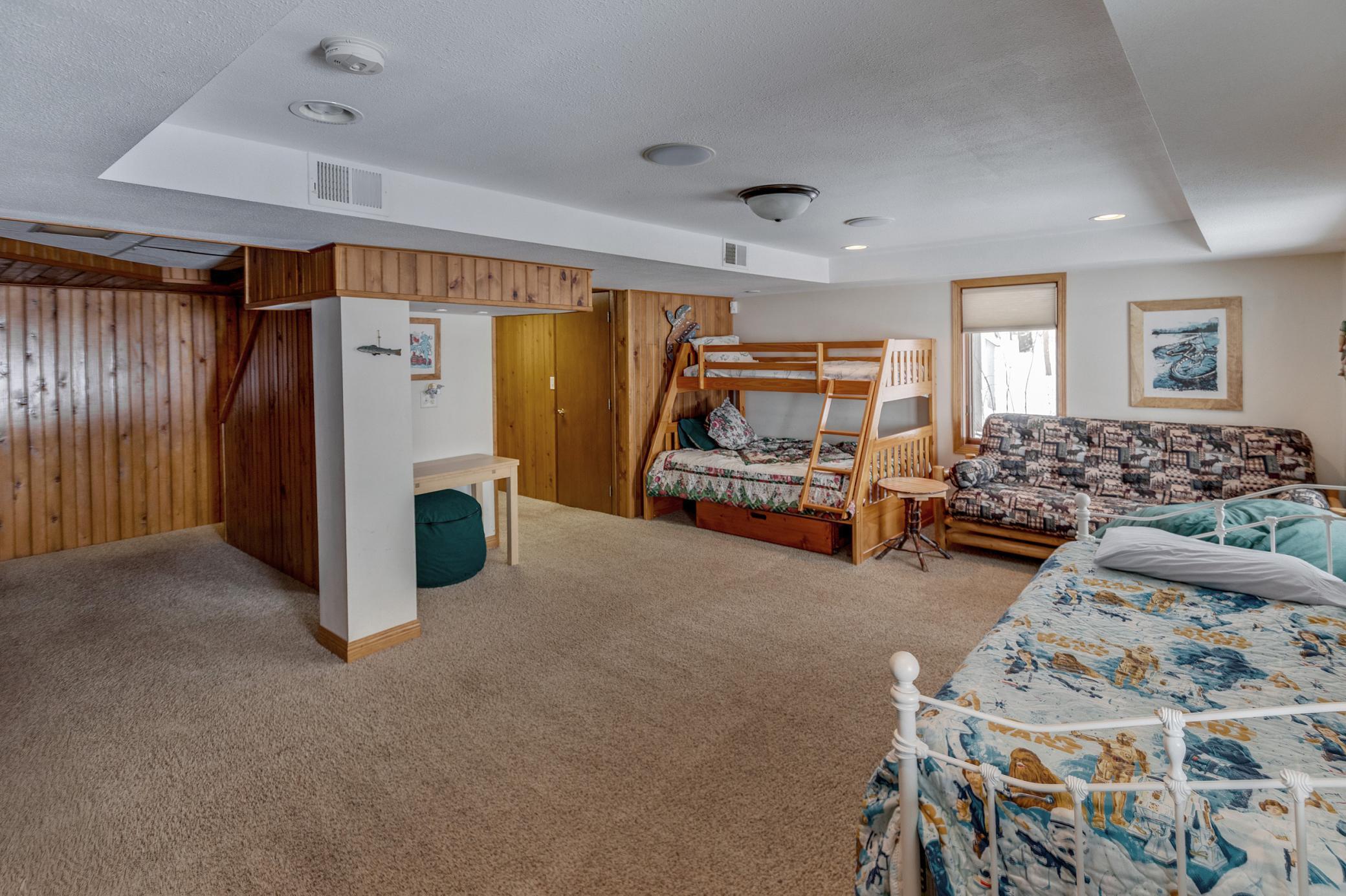 Family room downstairs with bunk beds
