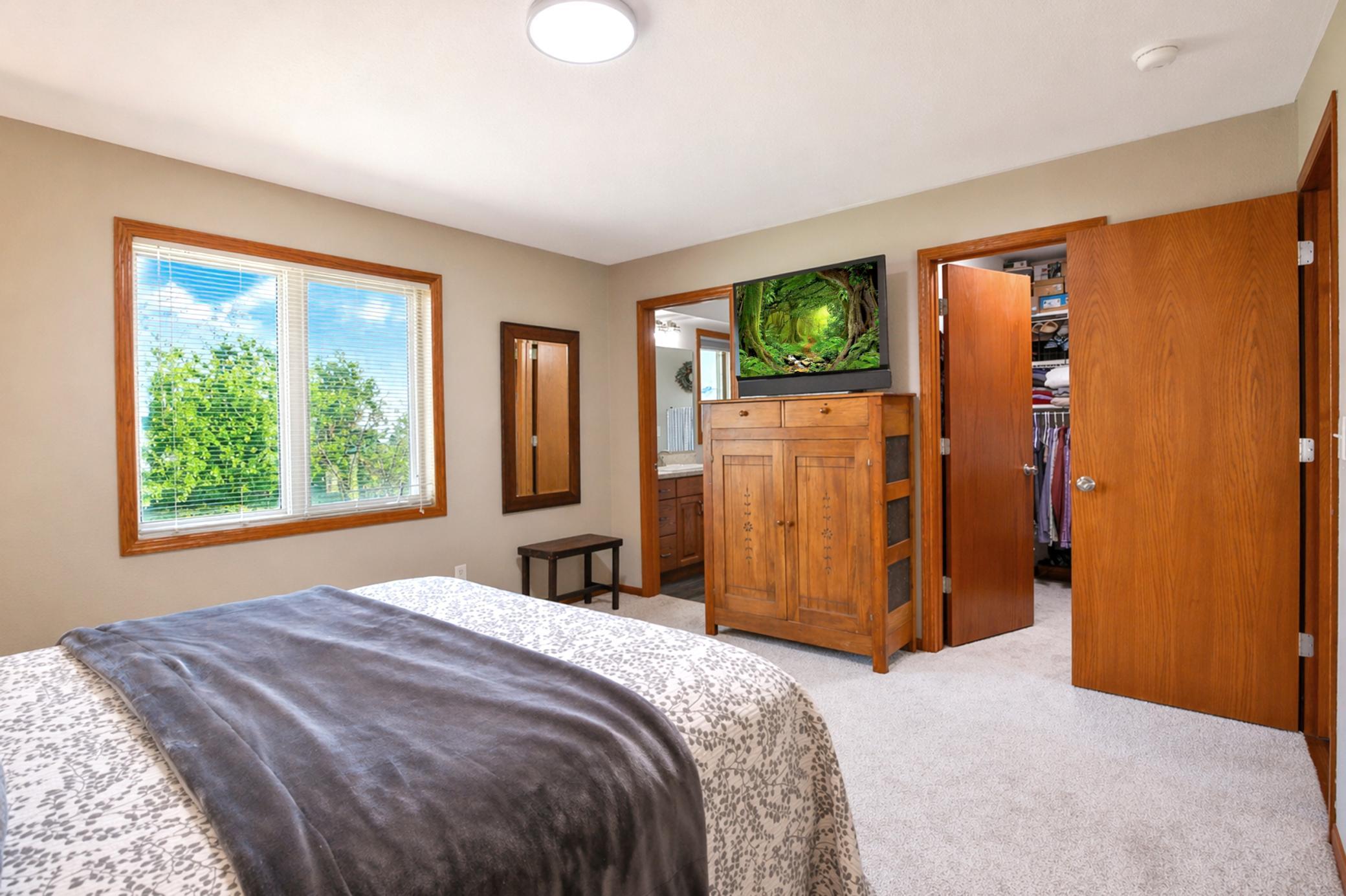 The primary bedroom has ensuite 3/4 bathroom and generously sized walk-in closet