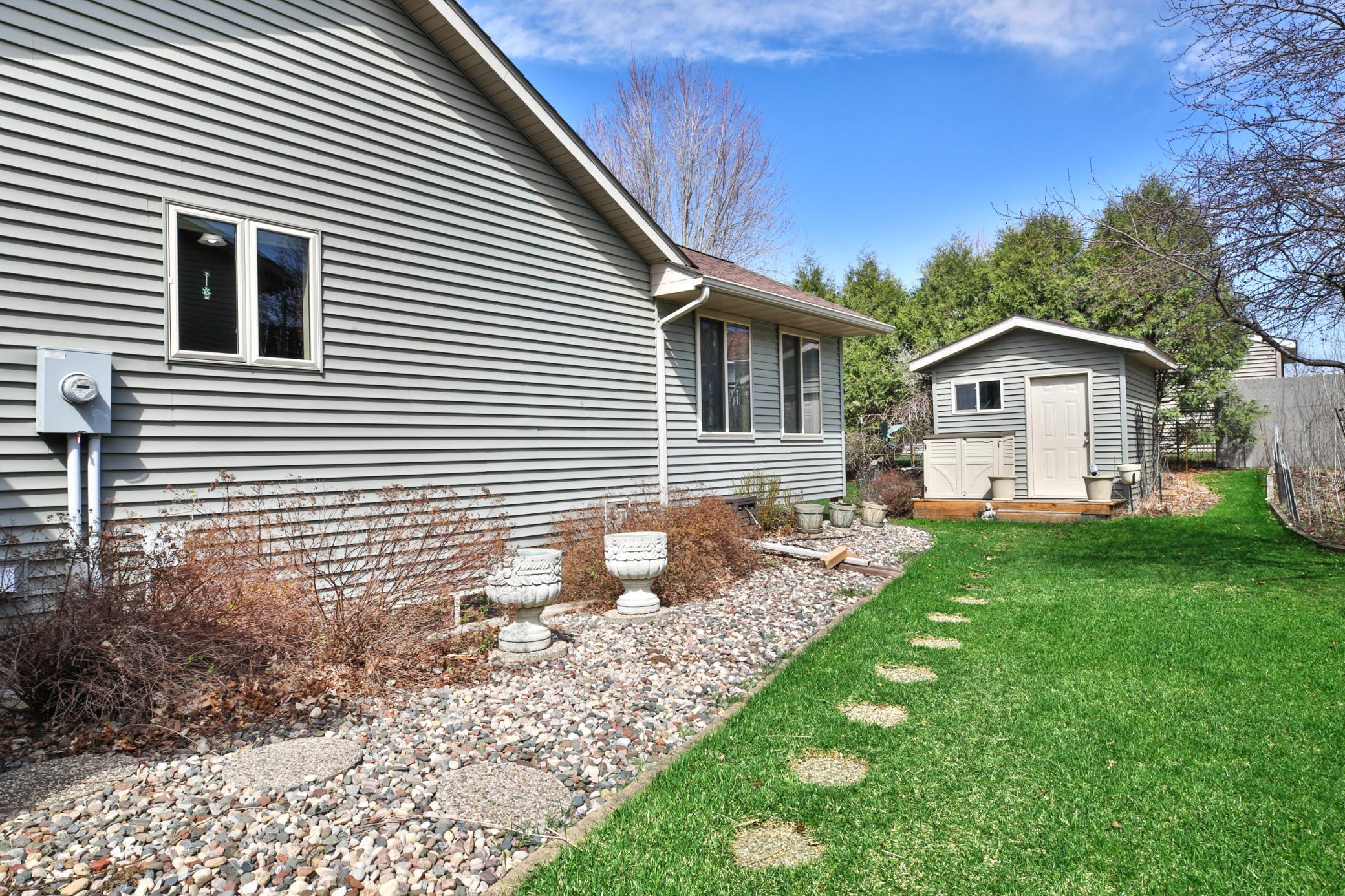 Side yard with view towards shed