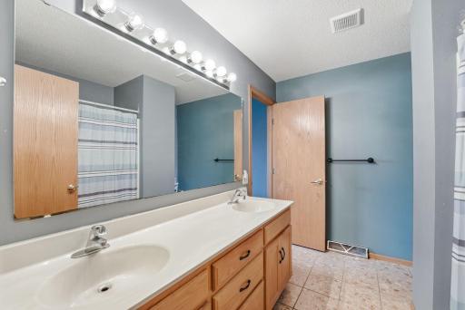 The walk through bathroom offers extra privacy for the primary bedroom