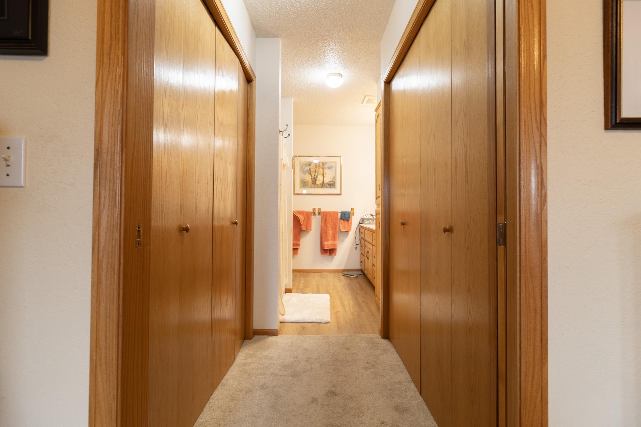Primary Suite Features Double Closets and Ensuite Bathroom
