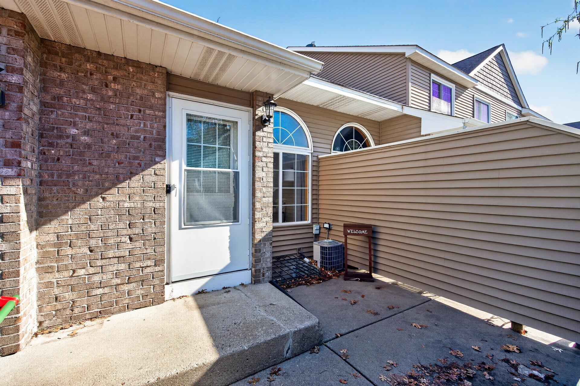 Super cute front patio just needs some finishing touches and colorful furniture. East facing for that perfect light