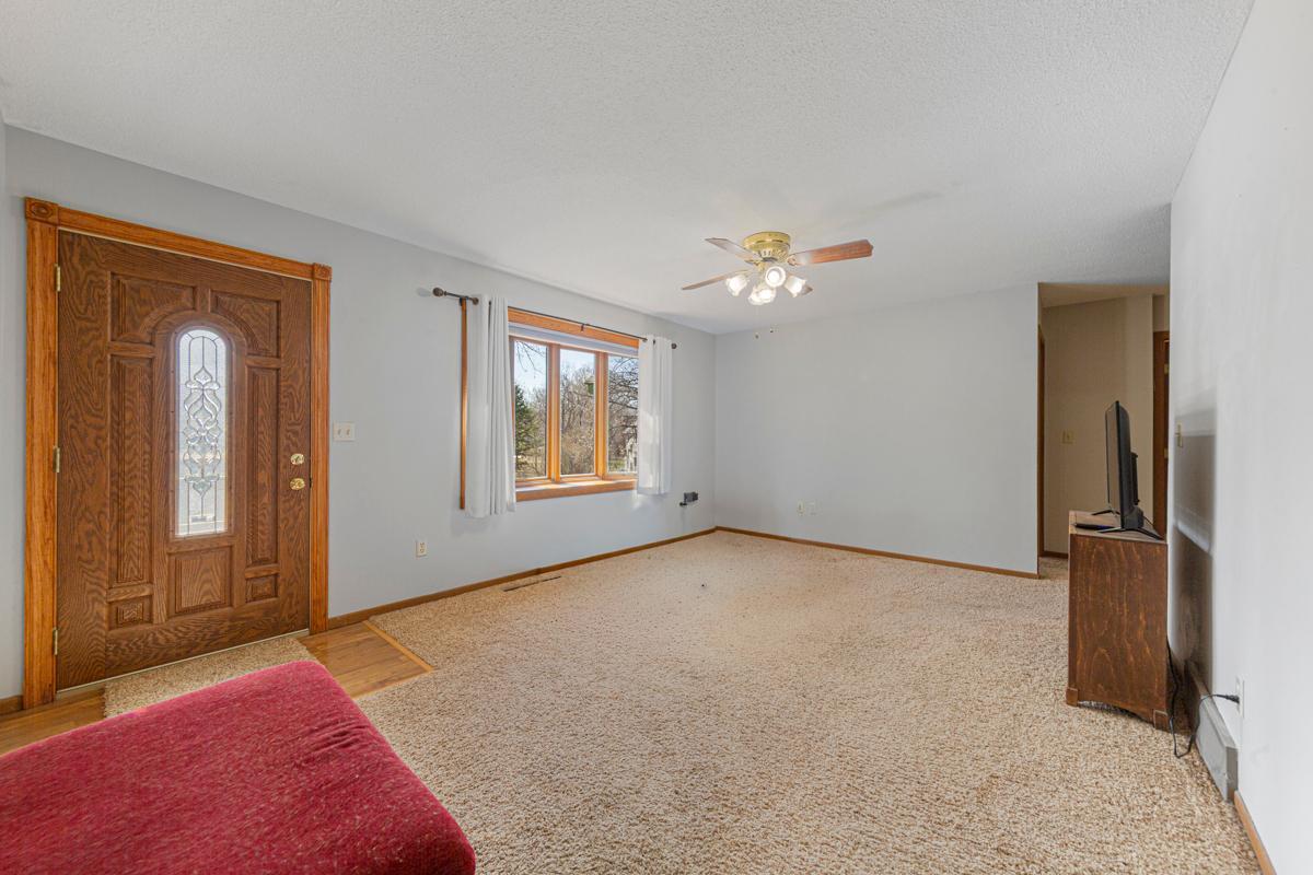 Large living room area also has a ceiling fan to keep air moving throughout the home