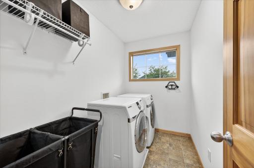 Laundry room is conveniently located in the upper level with the 4 bedrooms.