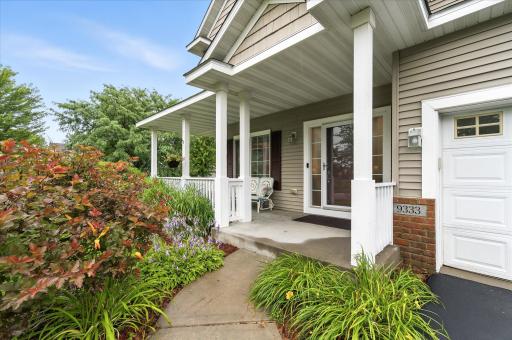 A welcoming front porch sets the tone for a thoughtfully designed floor plan with comfortable living spaces inside and out.