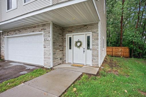 Front door with views of the backyard privacy fence