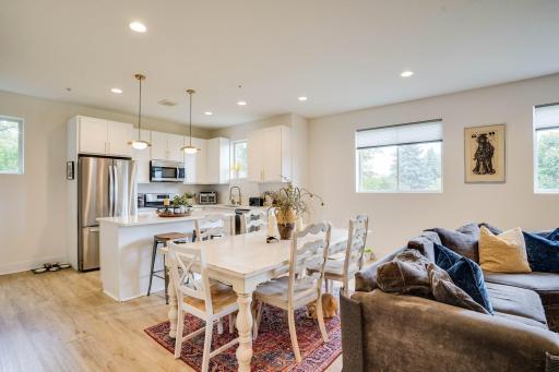 Picture taken from the living room shows the kitchen and dining room.