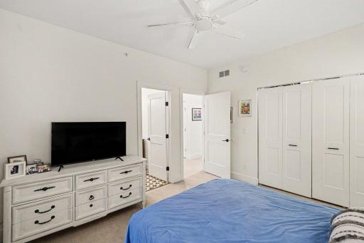 Another view of the primary bedroom shows the access to the private 3/4 bath