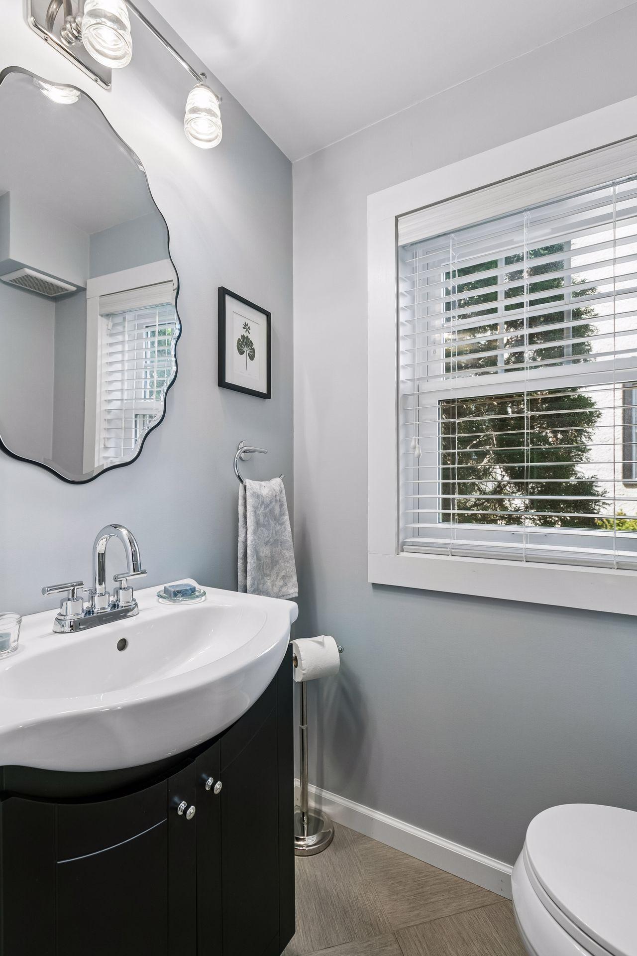 A fresh 1/2 bathroom off the kitchen on the main level was added in 2017.