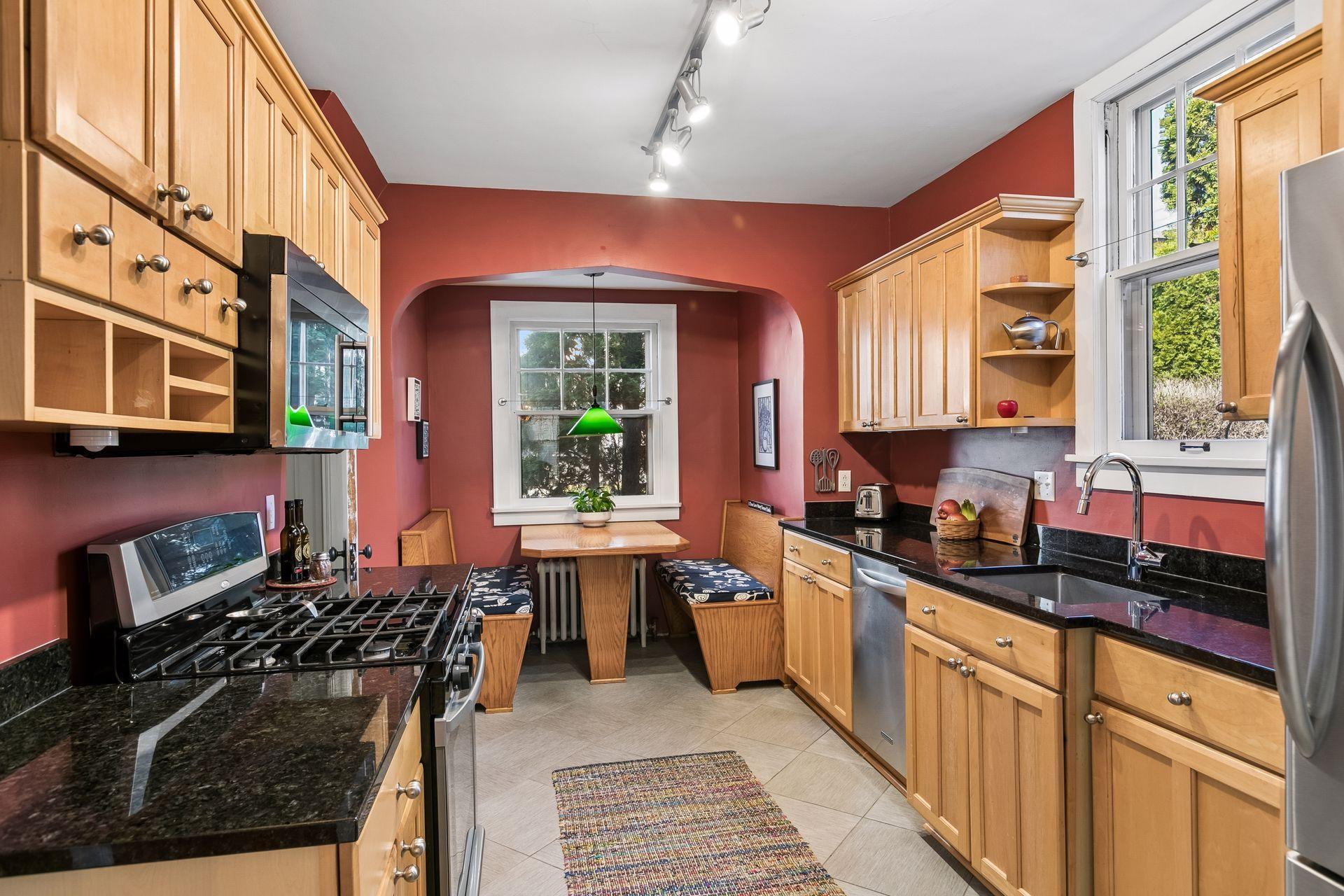 Generous kitchen designed for the avid cook, complete with the cutest breakfast nook—perfect for enjoying casual meals.