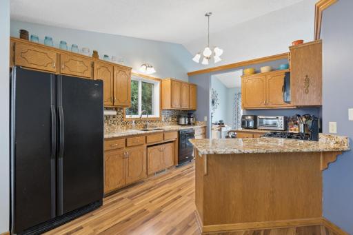 The layout of the kitchen is cool and unique! Love the angled breakfast bar area!