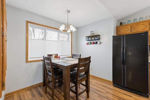 Nice space in the kitchen for your table. Fabulous windows!