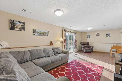 The lower level family room is massive! Note the gorgeous wood floors!