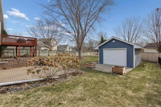 Another view of the backyard shed. Note the large overhead door for easy access for your toys, lawn tools, a car? or whatever you want to store here. There is also a side access door. So nice!