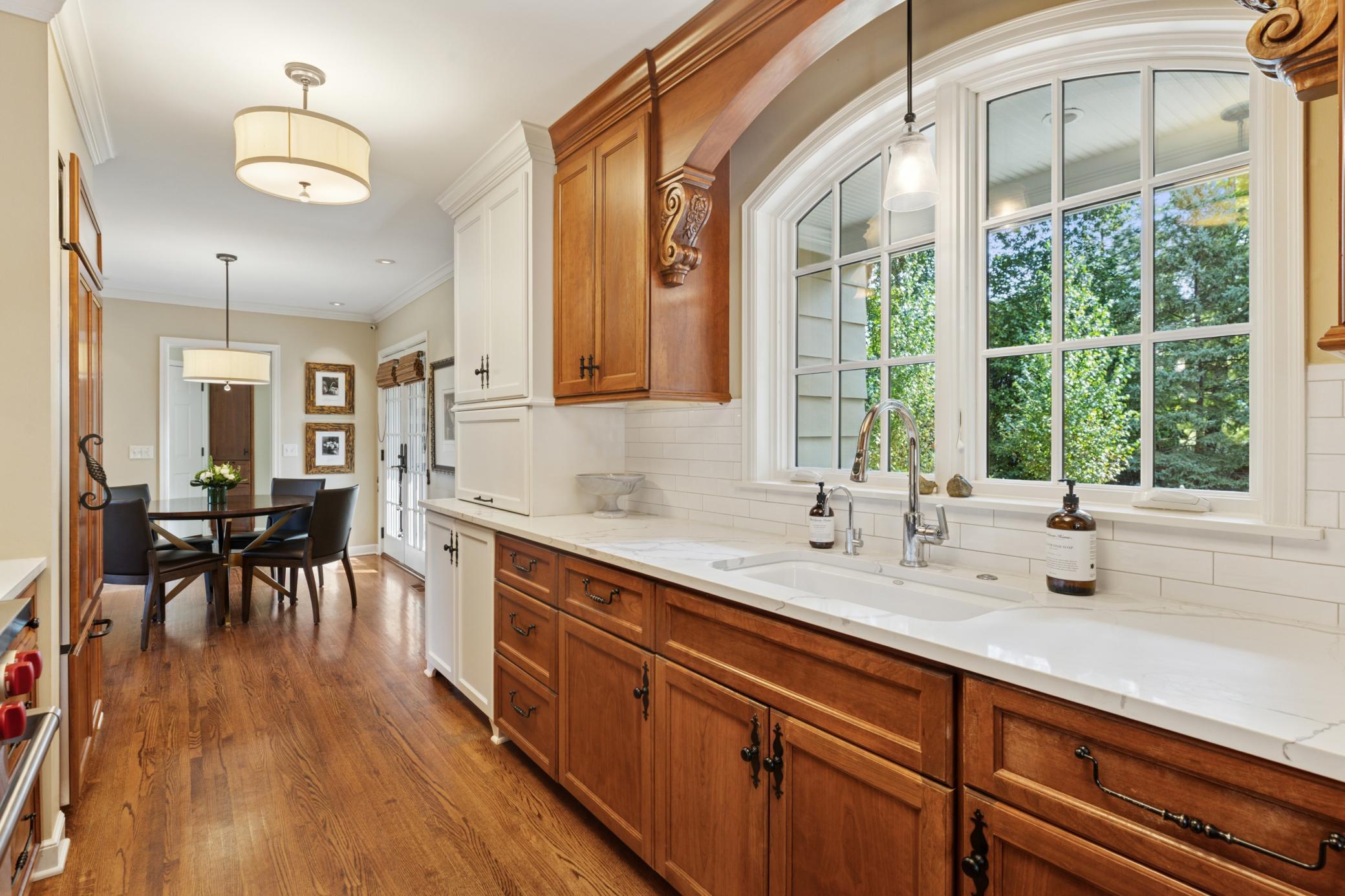 Beautiful custom arched Marvin window, quartz countertops, kalista faucet and kohler sink.