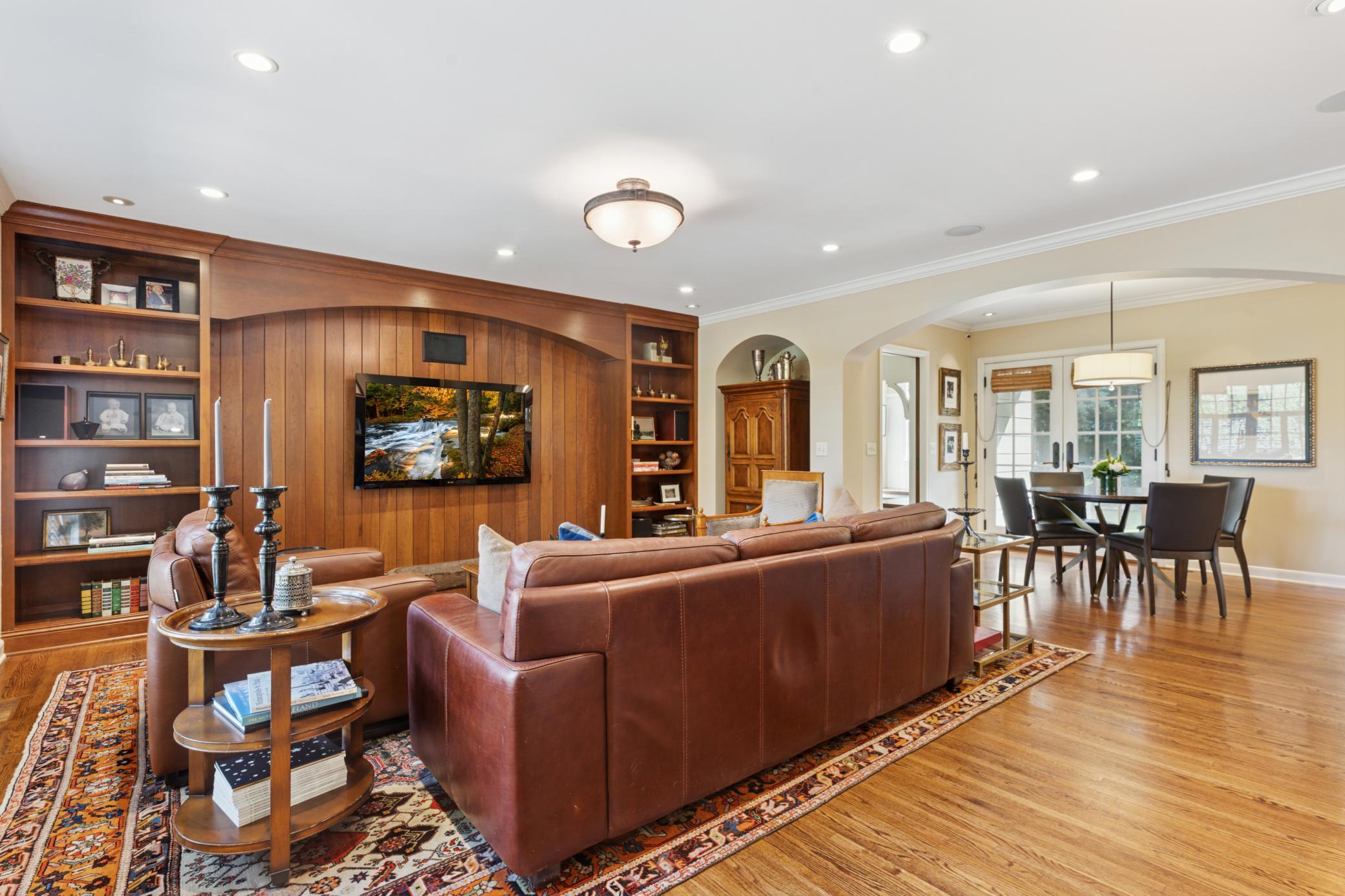 Main floor family room has beautiful woodwork and built-ins from floor to ceiling