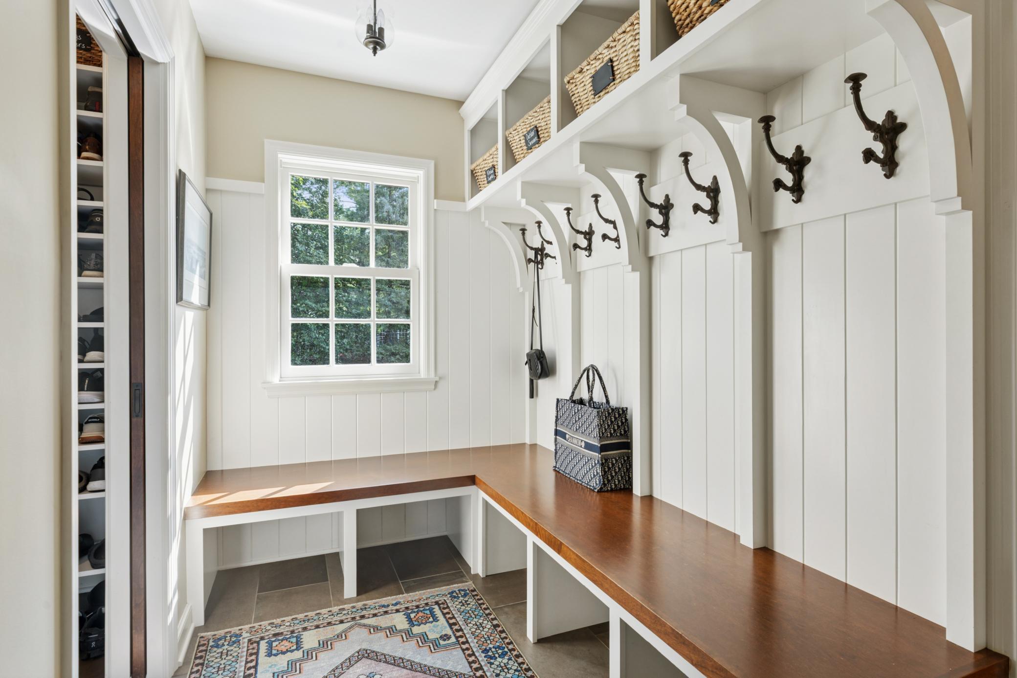 Walk in from the impeccable garage with extra hobby room and heated floors into a great mudroom