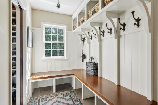 Walk in from the impeccable garage with extra hobby room and heated floors into a great mudroom