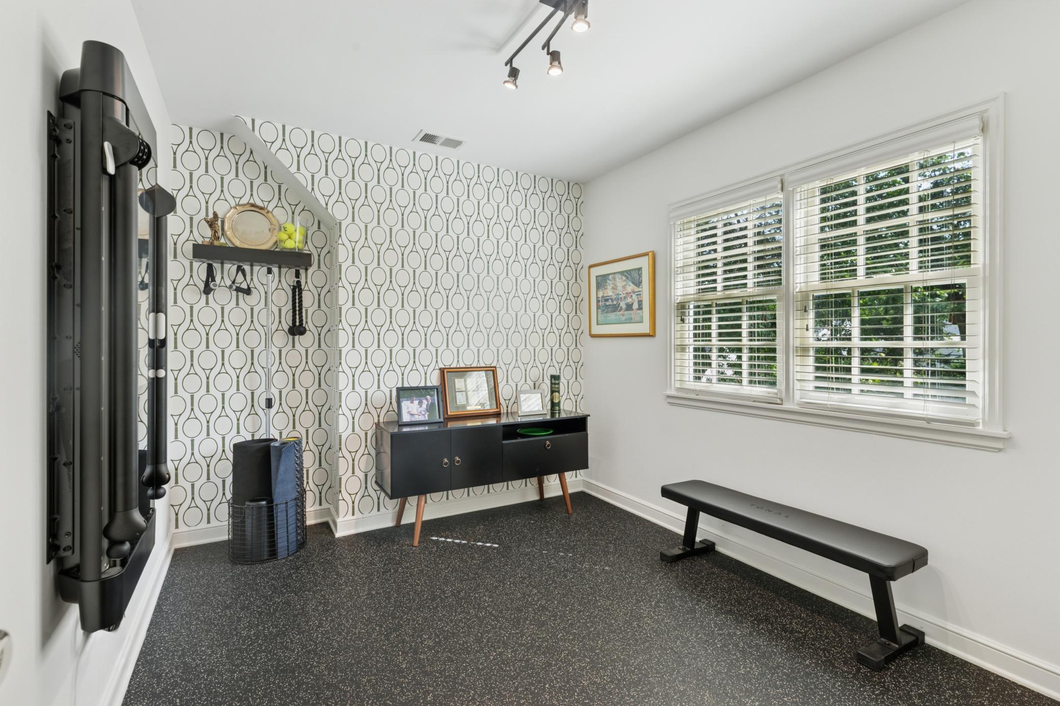 Fifth bedroom currently used for convenient exercise room