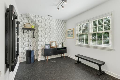 Fifth bedroom currently used for convenient exercise room