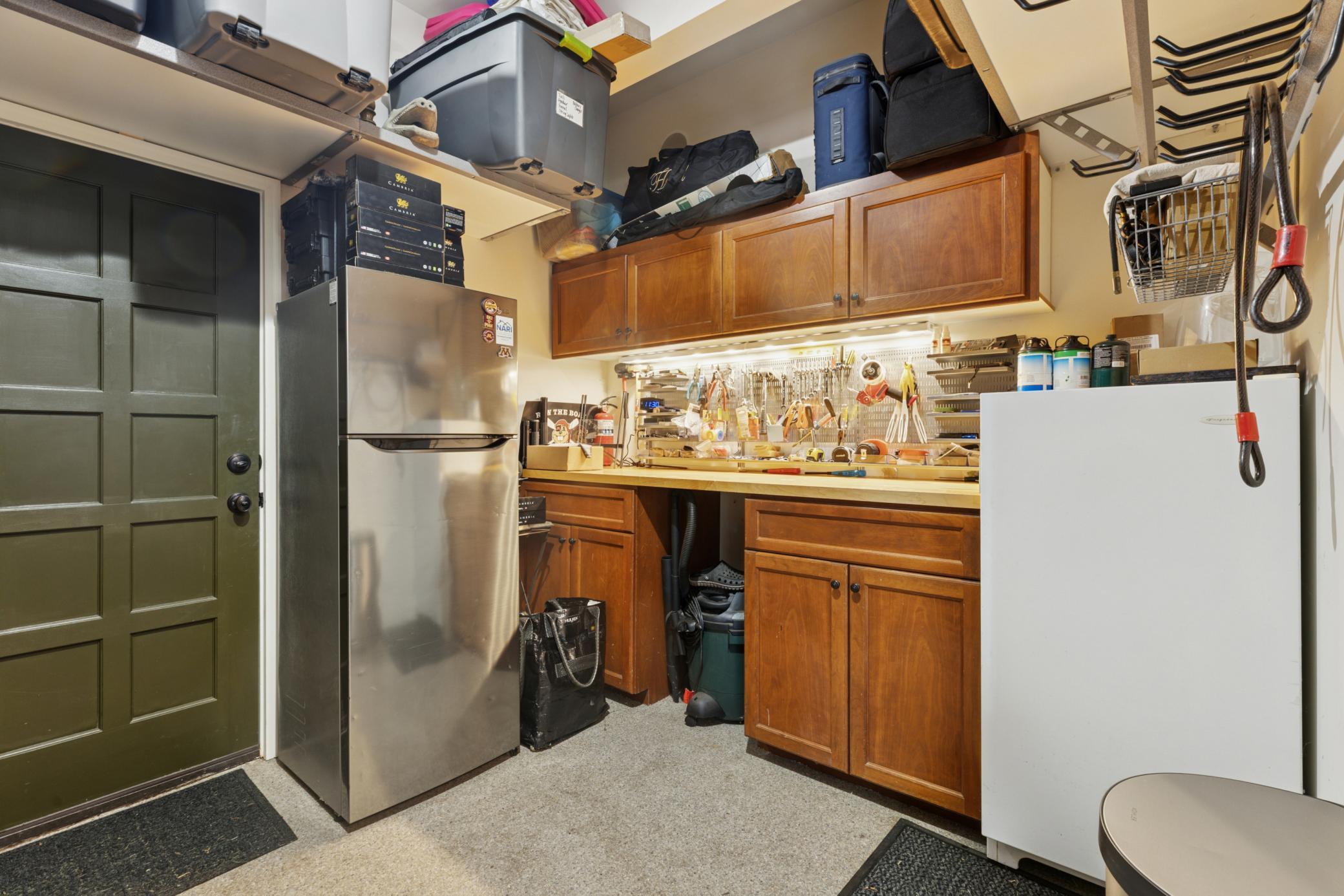 Perfect hobby room which you enter from garage and has heated floors, ample storage, surround sound system and convenient service door leading to the backyard.