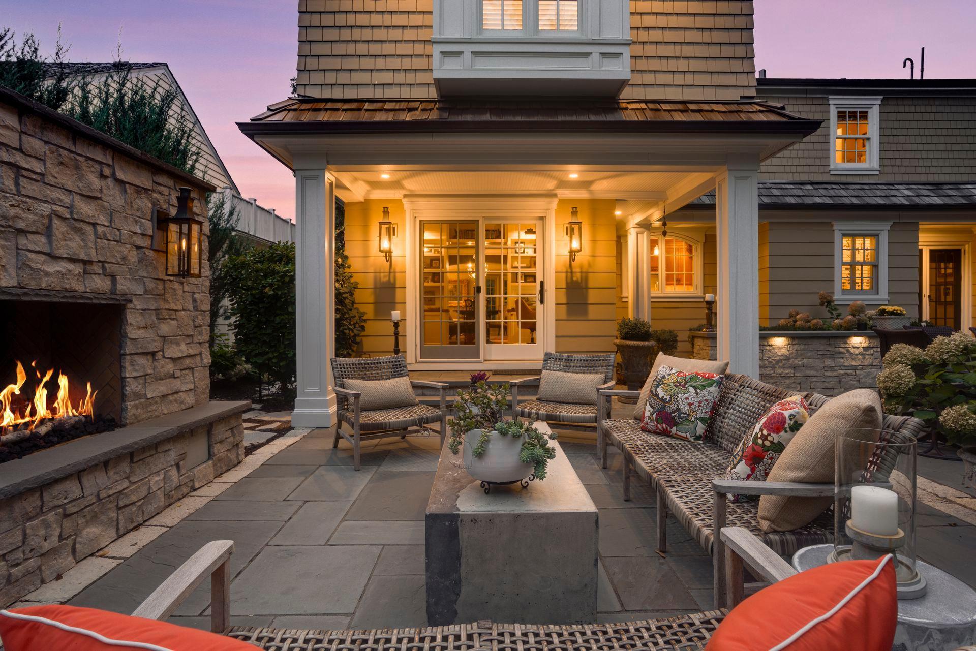 Beautiful premium blue stone outdoor patio with gas and electric connection is in island landscaping. Gas connection at grilling pad. All pots and landscaping are on a sprinkler system