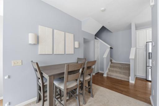 The garage is tucked under the unit and offers a separate entrance space, on the way upstairs you'll find a powder bath that is just down a few steps off the kitchen.