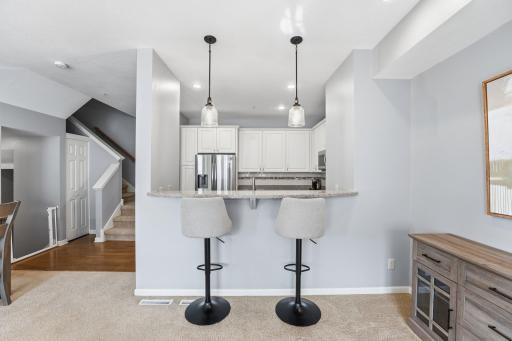 The breakfast bar offers plenty of space to socialize while cooking.