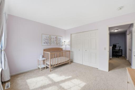 Guest bedroom upstairs is being used as a nursery, but has plenty of room for a bed or make it an office.