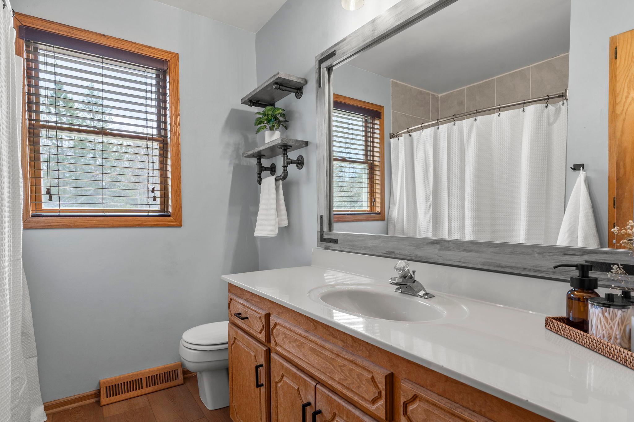 All bedrooms are conveniently located near a shared full bathroom with a large single vanity, storage, and a tub/shower combination.