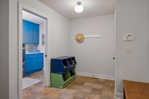 From garage, walk into mudroom and adjacent laundry room