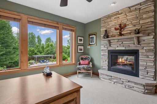 Office has other side of family room fireplace