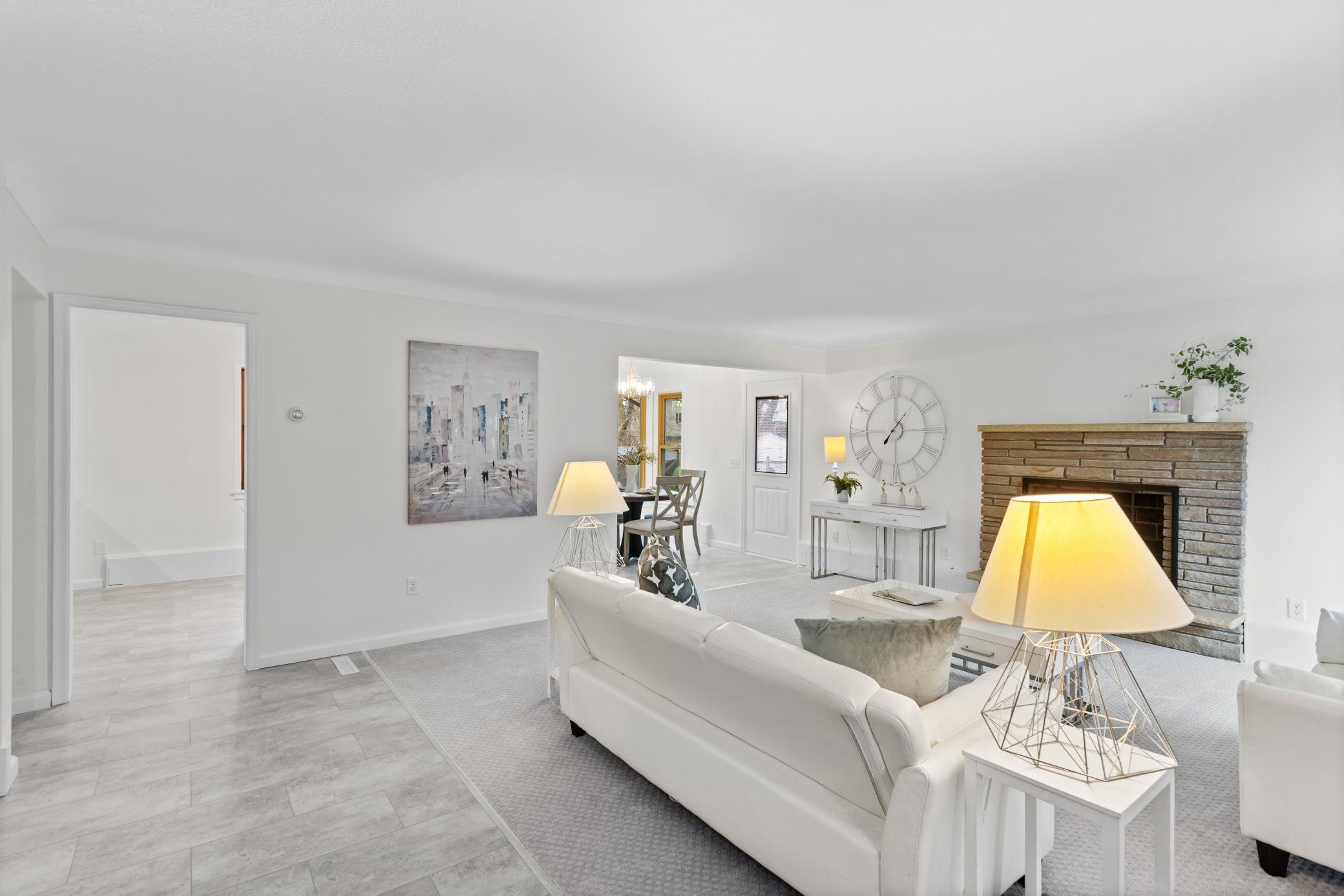 Living room with some separation to the kitchen/dining area