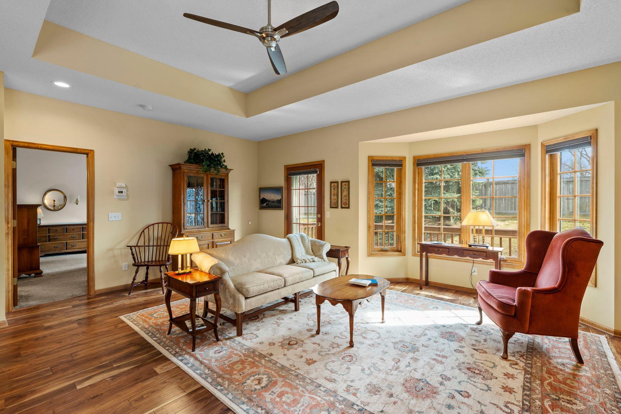 Custom oak built-ins offer additional storage and display space, while easy access to the deck supports relaxed indoor-outdoor living.