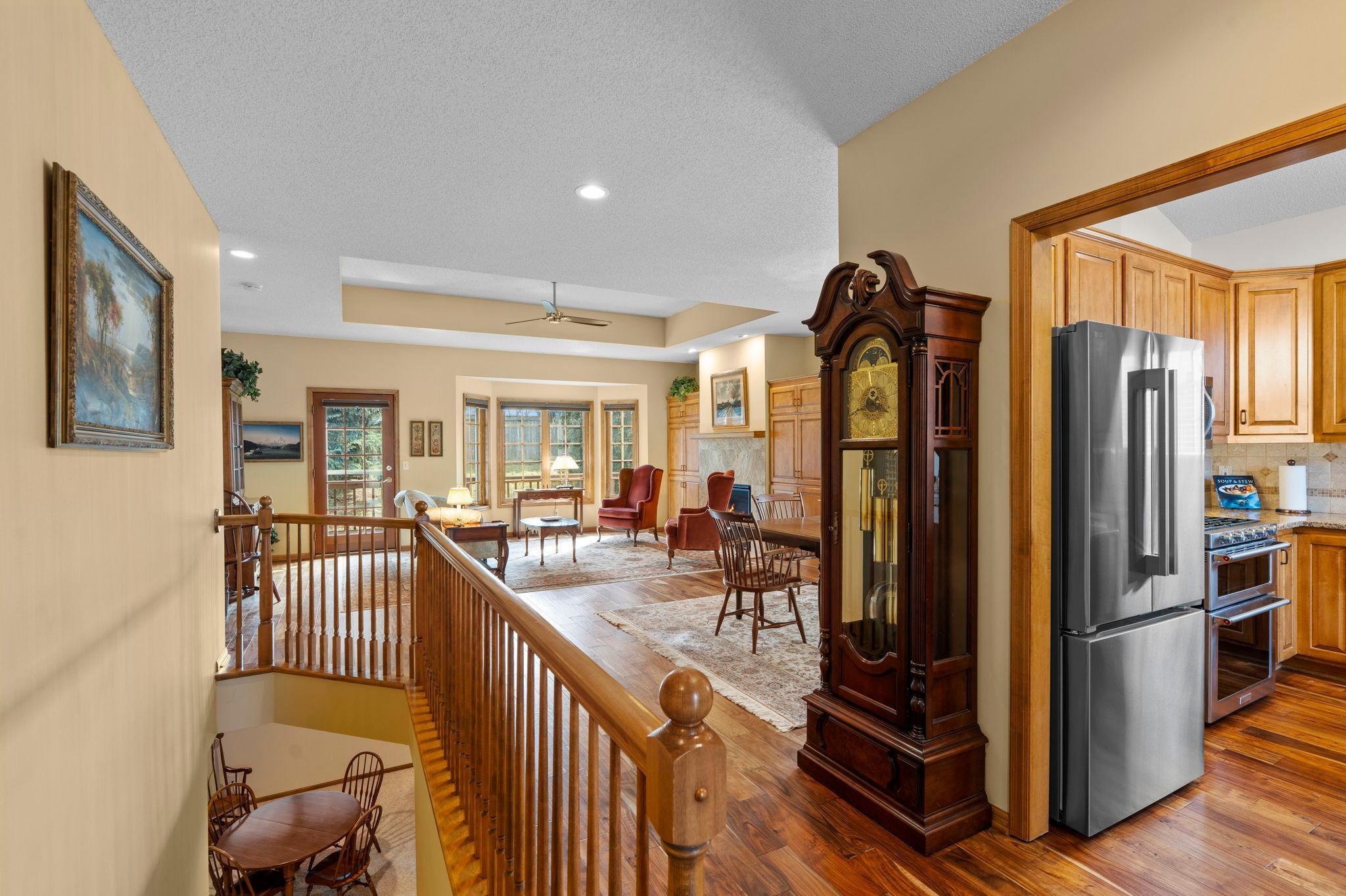 The main living area welcomes you with 9-ft ceilings throughout, and an open layout that seamlessly connects the formal dining space and living room.