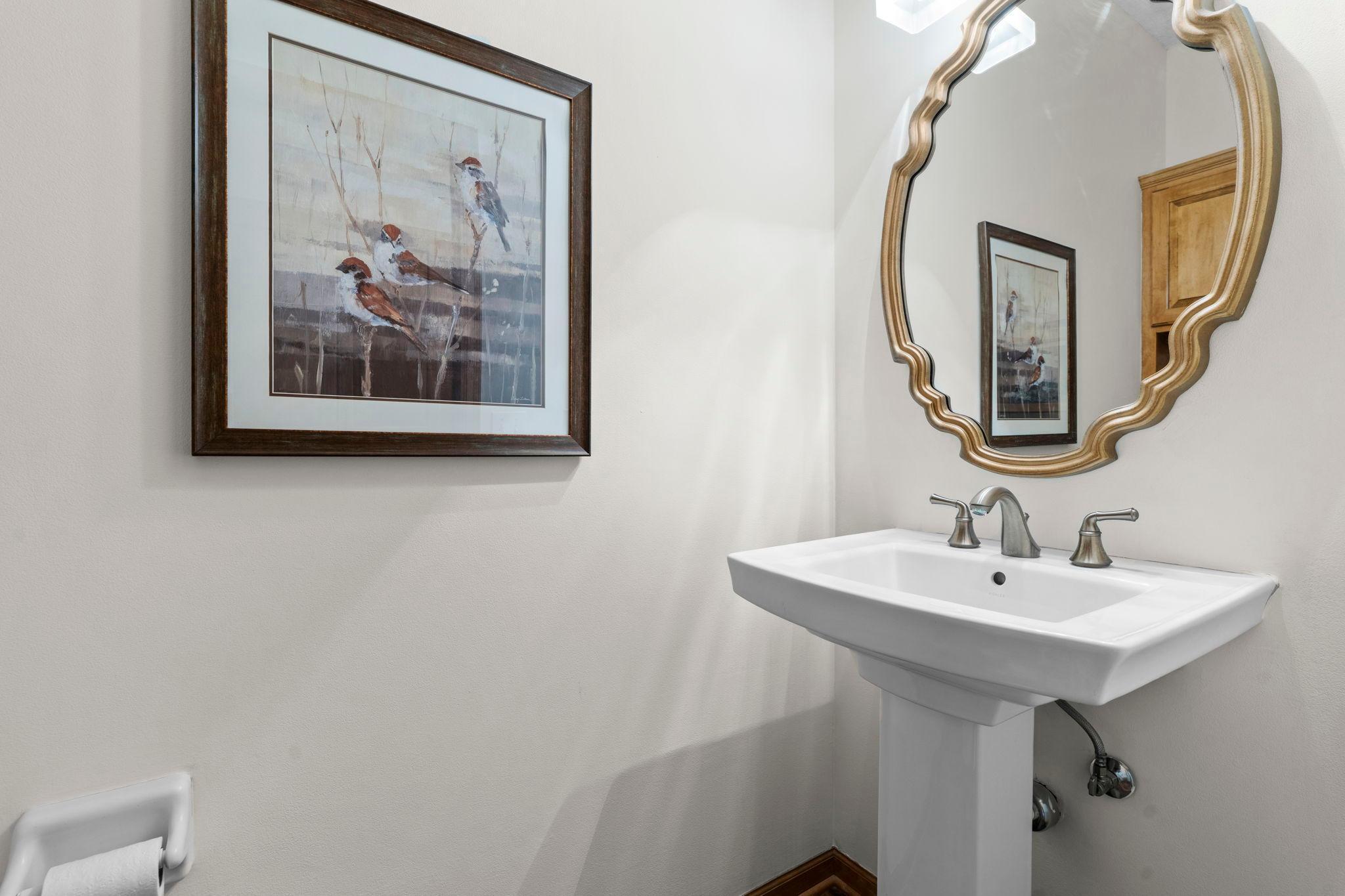 A conveniently located, main-level ½ bath and hall storage add to the home’s functionality.