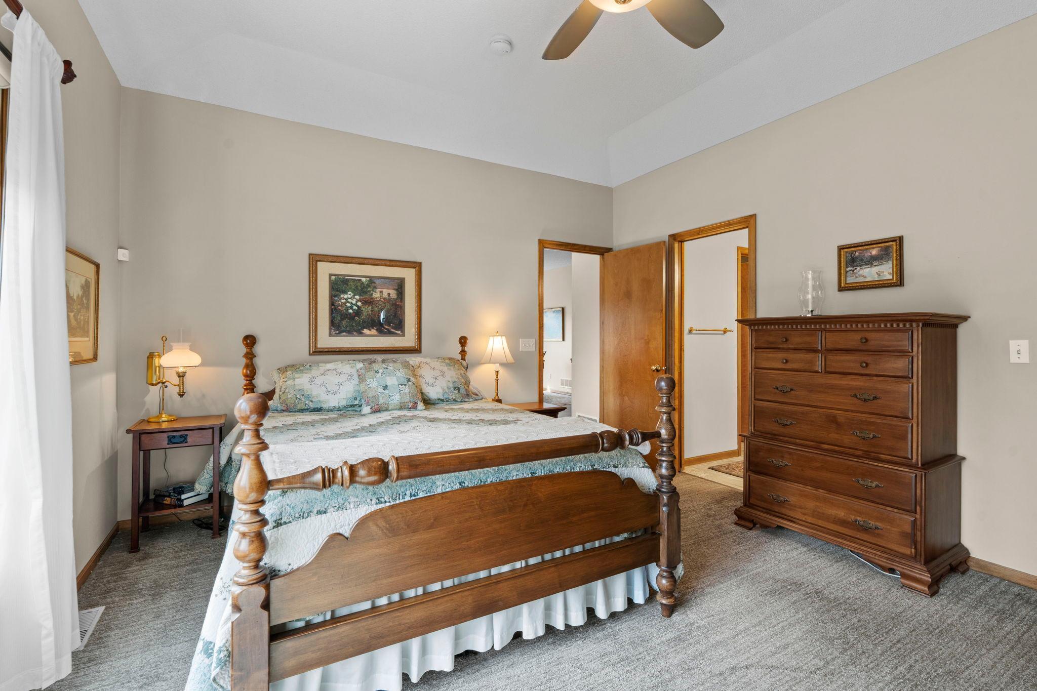 Large windows fill the room with natural light, creating a bright and inviting atmosphere.